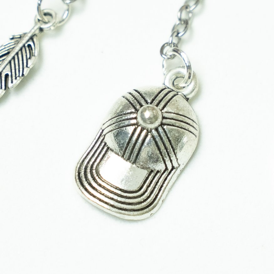 Silver cap from Patch Cipriano. Hush hush keycharm