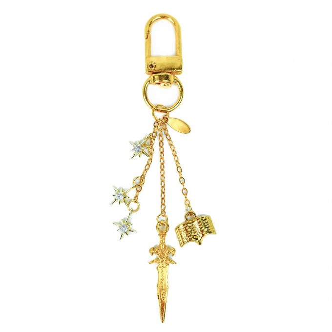 Keycharm with dagger, book and stars charms. Golden edition