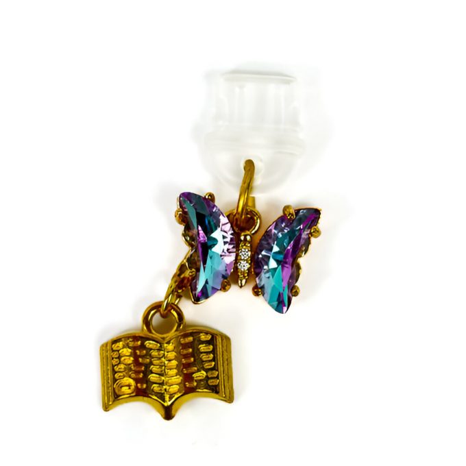 Golden butterfly charm and book inspired by Quicksilver. Dustcharm