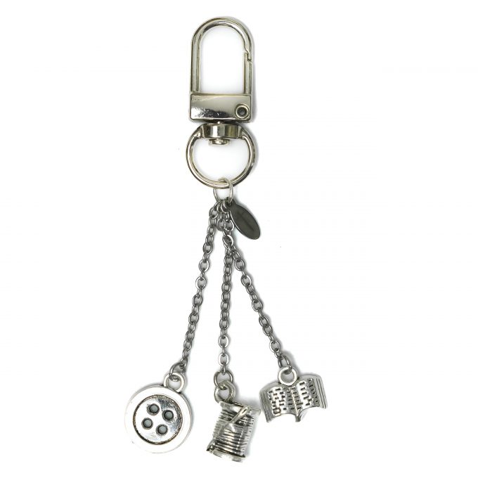 Adena KeyCharm Powerless featuring spool, needle, button, and book