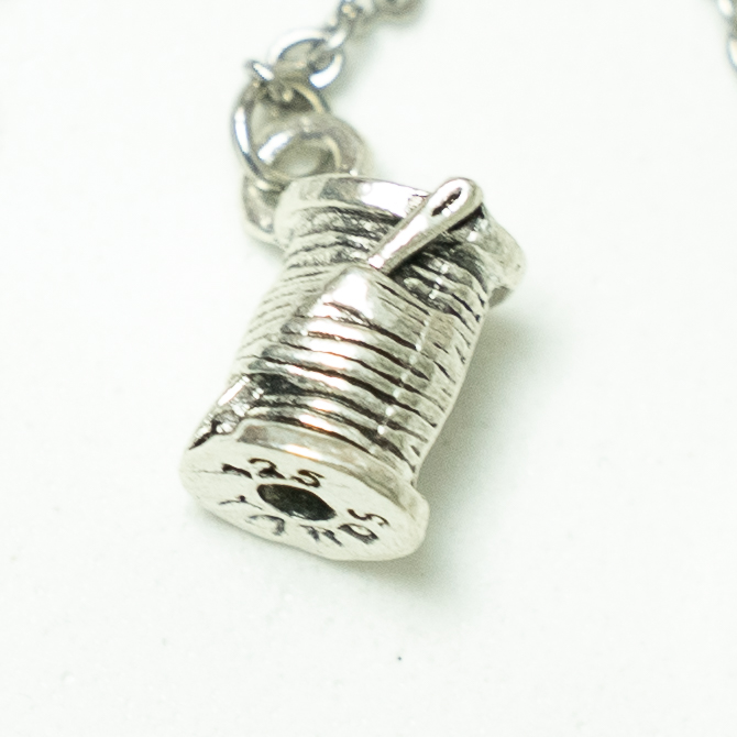 Silver charm inspired by Adena