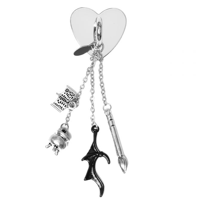 Cauldron StickyCharm with cauldron, bat wings, paintbrush, and book charms inspired by ACOTAR.