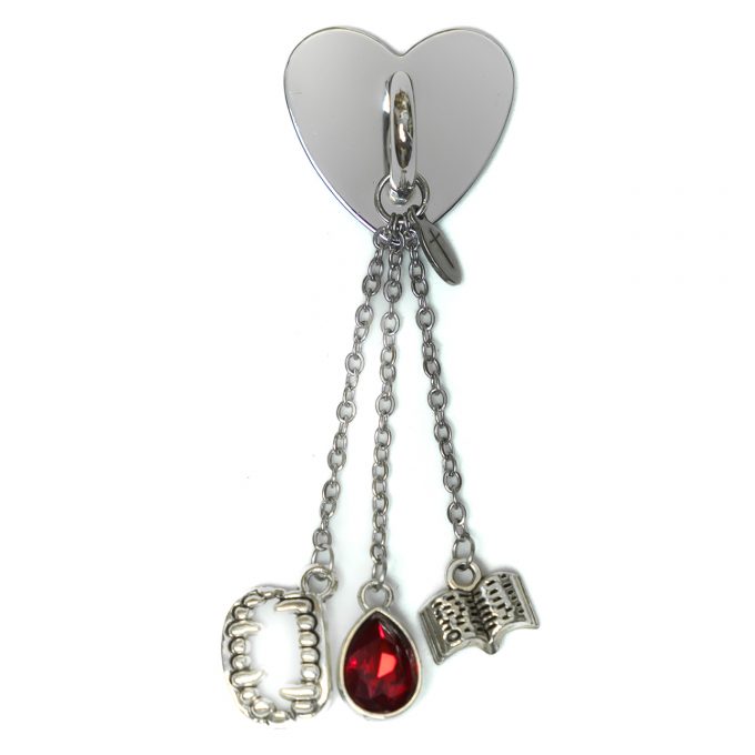Vampire StickyCharm Twilight with fangs, crimson stone, and book.