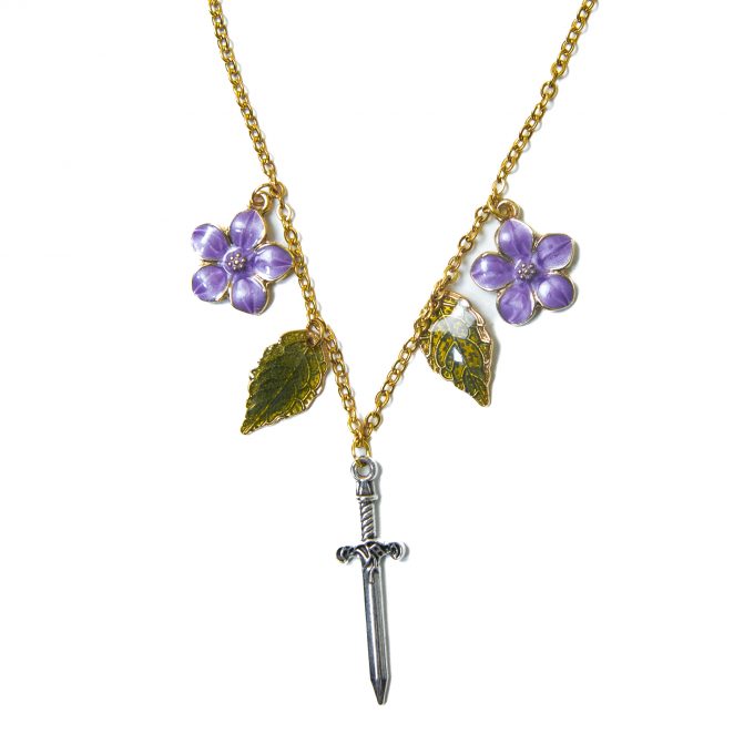 Golden necklace with a silver dagger and lilac flower charms